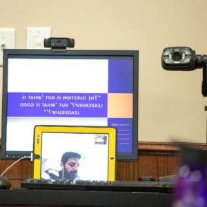 Professor delivering lecture via video chat